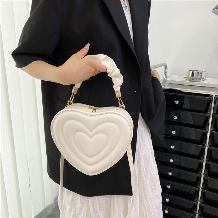 Wholesale Women Fashion Solid Color Heart-Shaped Zipper Mini Handle Crossbody Bag