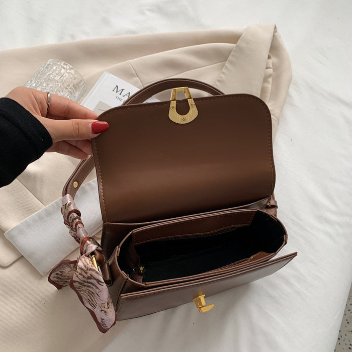 Wholesale Women Fashion Simple Solid Color Love Lock Saddle Shoulder Bag